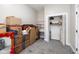 Bedroom with closet, built in shelving, and space for storage at 33 N Beville Ave, Indianapolis, IN 46201