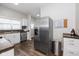 Bright kitchen featuring stainless steel appliances and modern white cabinetry at 33 N Beville Ave, Indianapolis, IN 46201