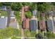 Aerial view of the property highlighting the backyard, detached garage, landscaping, mature trees and surrounding neighborhood at 333 N Kenyon St, Indianapolis, IN 46219