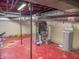 Basement utility area with exposed ductwork, painted flooring, HVAC system, water softener and access to utilities at 333 N Kenyon St, Indianapolis, IN 46219