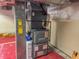 HVAC system with ductwork in the basement utility area with painted floor at 333 N Kenyon St, Indianapolis, IN 46219