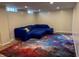 Finished basement area with comfortable seating and decorative carpet at 333 N Kenyon St, Indianapolis, IN 46219