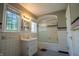 Bathroom features black and white checkered floors, tiled walls, and a shower with a glass door at 333 N Kenyon St, Indianapolis, IN 46219