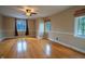 Spacious bedroom featuring hardwood floors and large windows for natural light at 333 N Kenyon St, Indianapolis, IN 46219