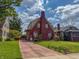 Charming brick home with well-manicured lawn, driveway, and inviting curb appeal at 333 N Kenyon St, Indianapolis, IN 46219