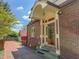 Charming brick home featuring a welcoming entrance and a well-kept walkway at 333 N Kenyon St, Indianapolis, IN 46219