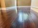 Close up of dark, hardwood flooring with high gloss finish at 333 N Kenyon St, Indianapolis, IN 46219