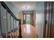 Inviting foyer featuring hardwood floors and an open doorway at 333 N Kenyon St, Indianapolis, IN 46219
