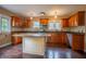 Traditional kitchen with ample storage, center island, granite counters, and stainless steel appliances at 333 N Kenyon St, Indianapolis, IN 46219