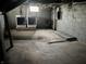 Unfinished basement with concrete floors, washer, and dryer hookups at 3443 Broadway St, Indianapolis, IN 46205