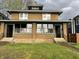 Two-story brick home with a symmetrical facade and inviting front entrances at 3443 Broadway St, Indianapolis, IN 46205