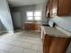 Functional kitchen with linoleum flooring, ample cabinet space, and essential appliances at 3443 Broadway St, Indianapolis, IN 46205