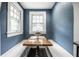 Charming breakfast nook featuring built-in benches and bright natural light through two windows at 357 N Kenyon St, Indianapolis, IN 46219