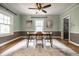 Dining room featuring a modern chandelier, table for four, and a large window at 357 N Kenyon St, Indianapolis, IN 46219