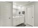 Bathroom featuring double sinks with contemporary cabinets and a large mirror at 3719 Lexham Ct, Danville, IN 46122