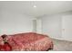 Bright bedroom showcasing neutral walls and carpet, and white doors at 3719 Lexham Ct, Danville, IN 46122