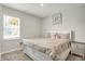 Inviting bedroom features a cozy bed, large window, and soft neutral tones for a tranquil ambiance at 3719 Lexham Ct, Danville, IN 46122