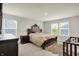 Bedroom showcasing windows, a cozy bed, and neutral decor at 3719 Lexham Ct, Danville, IN 46122