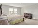 Bedroom featuring windows, a cozy bed, and neutral decor at 3719 Lexham Ct, Danville, IN 46122