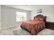 Cozy bedroom featuring a plush bed with elegant paisley bedding and a window offering natural light at 3719 Lexham Ct, Danville, IN 46122