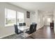 Dining room with a modern table and views from large windows at 3719 Lexham Ct, Danville, IN 46122
