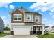 Charming two-story home featuring a two-car garage, landscaped yard and a welcoming front porch at 3719 Lexham Ct, Danville, IN 46122