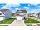 Charming two-story home featuring a two-car garage and landscaped yard on a sunny street at 3719 Lexham Ct, Danville, IN 46122