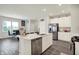 Bright kitchen features an island, stainless steel appliances, and recessed lighting at 3719 Lexham Ct, Danville, IN 46122
