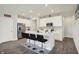 Bright kitchen featuring white cabinets, stainless steel appliances, and modern island with bar seating at 3719 Lexham Ct, Danville, IN 46122