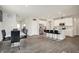 Open concept living room and kitchen featuring stainless steel appliances and modern finishes at 3719 Lexham Ct, Danville, IN 46122