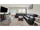 Inviting living room features a comfortable sectional sofa, stylish decor, and sliding glass doors at 3719 Lexham Ct, Danville, IN 46122