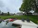Expansive backyard with a dock and lake access, surrounded by lush greenery at 3829 Waycross Dr, Columbus, IN 47203