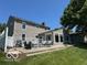 A spacious backyard with a patio, outdoor seating, and a well-maintained lawn for relaxing and entertaining at 3829 Waycross Dr, Columbus, IN 47203