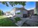 Well-maintained backyard with a stone patio, garden beds, and easy access to the home's exterior at 3829 Waycross Dr, Columbus, IN 47203