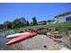 Lakefront property featuring kayaks on the shoreline, providing stunning views and outdoor adventures at 3829 Waycross Dr, Columbus, IN 47203