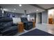 Finished basement area features two recliners and a glimpse of the bathroom at 3829 Waycross Dr, Columbus, IN 47203