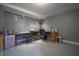 Spacious basement featuring epoxy flooring and plenty of room for work and hobbies at 3829 Waycross Dr, Columbus, IN 47203