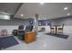 Finished basement including dual recliners and a high top table under recessed lighting at 3829 Waycross Dr, Columbus, IN 47203