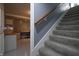 Staircase leads to a finished basement with plenty of storage and living space at 3829 Waycross Dr, Columbus, IN 47203
