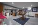 Finished basement space with a high top table set on an area rug at 3829 Waycross Dr, Columbus, IN 47203