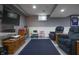 Finished basement with a large screen television and plenty of seating at 3829 Waycross Dr, Columbus, IN 47203