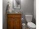 Basement half bathroom featuring granite countertops and modern finishes at 3829 Waycross Dr, Columbus, IN 47203