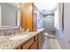 Stylish bathroom with a granite countertop, wood cabinets, and a tiled shower at 3829 Waycross Dr, Columbus, IN 47203