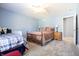 Bright bedroom with a cozy rug and light blue walls offers a comfortable and inviting space at 3829 Waycross Dr, Columbus, IN 47203
