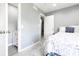 Bright bedroom with soft grey walls, and a closet providing ample storage space at 3829 Waycross Dr, Columbus, IN 47203