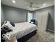 Cozy bedroom featuring soft carpet, a comfortable queen bed, and a bright window at 3829 Waycross Dr, Columbus, IN 47203