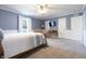 Large primary bedroom featuring a ceiling fan and chair with natural light and storage at 3829 Waycross Dr, Columbus, IN 47203