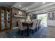 Elegant dining room featuring a large table, stone fireplace, and stylish décor at 3829 Waycross Dr, Columbus, IN 47203