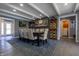 Elegant dining room featuring a large table, stone fireplace, and stylish décor at 3829 Waycross Dr, Columbus, IN 47203