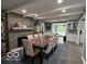 Spacious dining room featuring a stone accent wall and large table with seating for ten at 3829 Waycross Dr, Columbus, IN 47203